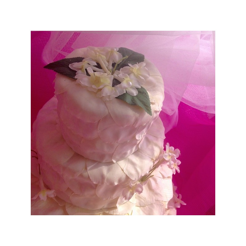 Four-tier cake decoration white petals and...